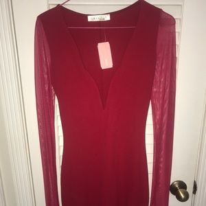 Sexy low cut red dress with sheer red sleeves.